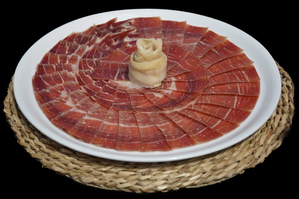 Travelers can find lots of delicious food and drinks in Madrid, Spain, including Iberico ham, Paella, Chorizo, and Basque Cheesecake